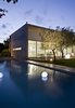 The site is masterfully landscaped and includes several decks and a reflecting pool. Photo 16 of eHouse modern home