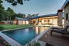 Exterior twilight photo of back patio and pool area Photo 2 of Industrial Modern Home built by husband and wife team modern home