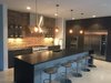 Modern industrial kitchen with Thermador appliances, Stevenswood cabinets and black leathered granite countertops. Photo 3 of Industrial Modern Home built by husband and wife team modern home
