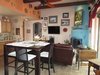 Great Room with wood burning fireplace all tile, granite countertop kitchen... Photo of Caliente Creek Ranch modern home