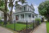 Victorian Farmhouse with restored front door & gas lanterns. Unique corner lot placement allowed for 2 front doors. Photo 3 of Victorian Restoration modern home