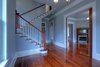Restored grand staircase with 4 distinct historic newel posts Photo 8 of Victorian Restoration modern home