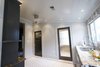 Kitchen - Entrance to powder room and laundry room. Photo 7 of Modern Victorian Interior modern home