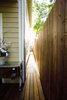 A side entrance was created so that when entertaining, guests could proceed directly to the backyard. Previously, this was dirt filled area that had little use. Photo 12 of Outdoor Living modern home