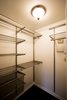 A walk-in closet was created in the space and outfitted with Elfa Shelving to allow for more storage for the tenant. Photo 10 of Asian Bungalow - Garden Apartment modern home