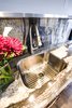Level 5 granite remnants and a large kitchen sink allowed this small apartment to feel like a loft. Photo 4 of Asian Bungalow - Garden Apartment modern home