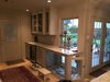 A beverage center, display case and a custom dog bed (including pull-out food bowls for the dogs) made a previously unusual space a favorite of the families. Photo 5 of ADA Kitchen modern home
