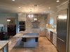 The new space - formerly divided by a wall between the kitchen and the family room - became a much needed focal point for the family. Photo 2 of ADA Kitchen modern home