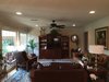 The family room - previously including dark wainscot - was renovated to flow with this kitchen and brightened up with crown and paint. Photo 8 of ADA Kitchen modern home