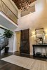 Dramatic two story foyer with stained coffered ceiling detail and barn sliding door Photo 10 of Modified Amelia II Model by DJK Homes modern home