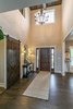 Dramatic two story foyer with coffered ceiling detail and barn sliding door Photo 13 of Modified Amelia II Model by DJK Homes modern home