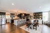 Large chef inspired kitchen with custom two tone design Photo 19 of Modified Amelia II Model by DJK Homes modern home