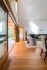 Living Room with lift and slide door and fireplace beyond Photo 20 of Gable House modern home