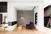 Modern home with Living Room, Light Hardwood Floor, Pendant Lighting, Chair, Wall Lighting, Two-Sided Fireplace, and Recessed Lighting. Taula House by M Gooden Design | Sitting Room Photo 5 of Taula House