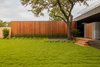 Modern home with Exterior, Flat RoofLine, Wood Siding Material, and House Building Type. Taula House by M Gooden Design | Garage Photo 6 of Taula House