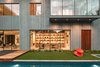Modern home with Exterior, Concrete Siding Material, Metal Siding Material, Wood Siding Material, and House Building Type. Taula House by M Gooden Design | Exterior // Library Photo 9 of Taula House