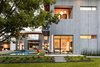 Modern home with Outdoor, Stone Patio, Porch, Deck, Raised Planters, Hardscapes, Hanging Lighting, Swimming Pools, Tubs, Shower, Trees, Side Yard, and Small Patio, Porch, Deck. Taula House by M Gooden Design | Side Yard Photo 8 of Taula House