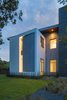 Modern home with Exterior, House Building Type, and Flat RoofLine. Taula House by M Gooden Design | "Slice" Photo 11 of Taula House