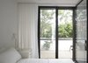 Modern home with Bedroom, Night Stands, Bed, Table Lighting, and Dark Hardwood Floor. Parents' Bedroom Photo 14 of Brooklyn Row 1