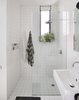 Modern home with Bath Room, Open Shower, Ceramic Tile Floor, Wall Mount Sink, Ceiling Lighting, Pendant Lighting, Ceramic Tile Wall, and One Piece Toilet. Bathroom Shower Photo 17 of Brooklyn Row 1