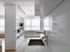 The surface of materials are chosen to meet function, and also add reflection or depth for the space. Photo 3 of KT Apartment modern home