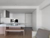 There are storage throughout the entire apartment, but its appearance is reduced to simple line that adds rhythm to the space. Photo 13 of KT Apartment modern home