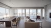 Modern home with Living Room, Chair, Sofa, Recessed Lighting, and Light Hardwood Floor. Neutral setting let the view of the city come to play. Photo of W Residence