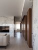 Modern home with Hallway and Light Hardwood Floor. Stone and wood veneer block define the space without separate it. Photo 3 of W Residence