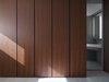 Modern home with Bath Room, Light Hardwood Floor, Recessed Lighting, Ceramic Tile Wall, Engineered Quartz Counter, and Wall Mount Sink. A glimpse of bathroom behind the closet. Photo 5 of W Residence