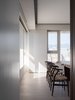 Modern home with Recessed Lighting, Chair, and Light Hardwood Floor. View of dinning area and the city from the kitchen. Photo 16 of W Residence
