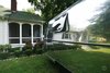 Modern home with Airstream Building Type, Metal Roof Material, Metal Siding Material, and Curved RoofLine. Gogo, Exterior / She sits just outside of a beautiful home in Shelter Island reflecting her surroundings. Photo 3 of Gogo, the 1974 Argosy