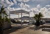 Modern home with Outdoor, Wood Patio, Porch, Deck, Decking Patio, Porch, Deck, Rooftop, and Large Patio, Porch, Deck. According to Sir Hotel's founder Liran Wizman, the aesthetic of Sir Joan is intentionally designed to "reflect the ethos of the surrounding area." Photo 4 of Sir Joan Hotel