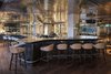 Modern home with Dining Room, Dark Hardwood Floor, Bar, and Stools. Interior of Izakaya at Sir Joan Photo 9 of Sir Joan Hotel