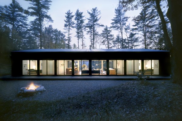 Nestled on a private six-acre lot in New York’s Hudson Valley, this glass cabin was designed by INC Architecture & Design.
