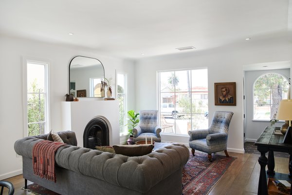 The living areas feature Belgian oak flooring with a vintage finish that lends warmth and character. The 19th-century fireplace was imported from a Victorian home in England, and Wijaya added a custom mantel.