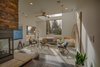 Sunken Living room with concrete floors to allow for solar passive heat. Danish Mid-century Modern minimalist furniture highlighting the motto “ Less is More.” Photo 2 of Modern Barn Revival modern home