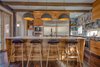 Full Chef's Kitchen to include a Commercial side-by Side Fridge/Freezer and Espresso maker. There are double ovens and double dishwashers with a walk in pantry. Motion sensor LED lighting under toe-kicks. Photo 4 of Modern Barn Revival modern home