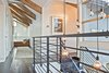 Hand built scissor trusses that were assembled on site with metal plates and bolts with rustic stain accents. Photo 7 of Modern Barn Revival modern home