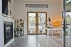 Detached studio with double glass doors leading to outdoor fire pit Photo 10 of Modern Barn Revival modern home