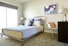 Modern home with Bedroom, Track Lighting, Bed, Storage, Wardrobe, Chair, Table Lighting, Night Stands, and Carpet Floor. Blue Queen Photo 7 of Waters Edge. Private Meiselman Mid-Century Modern with Views and Stunning Saltwater Pool