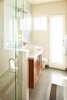 Modern home with Bath Room, Wall Lighting, Mosaic Tile Wall, Ceramic Tile Wall, Drop In Sink, One Piece Toilet, Enclosed Shower, Ceramic Tile Floor, Subway Tile Wall, and Engineered Quartz Counter. Bathroom Photo 8 of Waters Edge. Private Meiselman Mid-Century Modern with Views and Stunning Saltwater Pool