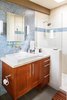 Modern home with Bath Room, Mosaic Tile Wall, Track Lighting, Drop In Sink, Wall Lighting, Engineered Quartz Counter, Enclosed Shower, Ceramic Tile Floor, Subway Tile Wall, Ceramic Tile Wall, and One Piece Toilet. Master Bath Photo 9 of Waters Edge. Private Meiselman Mid-Century Modern with Views and Stunning Saltwater Pool