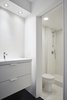Modern home with Bath Room, Enclosed Shower, Recessed Lighting, Ceramic Tile Wall, Vinyl Floor, and One Piece Toilet. View of Bathroom Photo 4 of MC01
