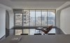 Modern home with Living Room, Recessed Lighting, Chair, and Vinyl Floor. View of Skyline and River from Kitchen Photo 11 of MC01