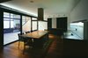 Kitchen and dining room with a view of the atrium Photo 7 of House K modern home
