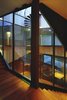 Atrium in the center of the house, and the staircase that winds around it Photo 8 of House K modern home