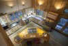 The hand built maple kitchen with walnut and mahogany island. The floor is poured concrete with radiant heating beneath. Photo 2 of The Bath House modern home