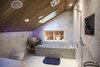 Upstairs the combined wet room and bathroom includes a hand built six feet long soaking tub with a river stone surface. The ceiling is cedar wood. Photo 4 of The Bath House modern home