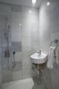 The entrance way also doubles as a mud room with a shower wet room. Photo 6 of The Bath House modern home