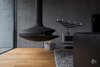 This South-Western Finland abode harnesses minimalist design with bare concrete walls inside and out. Inside, rustic oak floors and low room height creates a cozy escape, while large windows and multiple patios on the rocky plot offer beautiful views. Photo 3 of villAma modern home
